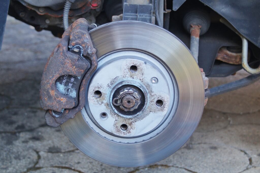 Brake pad thickness visual inspection guide showing healthy vs worn pad
